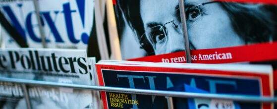 photo of magazine rack displaying The Economist magazine with Elizabeth Warren on the cover.